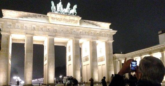 Brandenburg Gate in Berlin, Lit Up at Night, adapted from image at state.gov