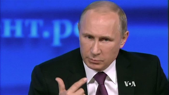 File Photo of Vladimir Putin Gesturing At Podium