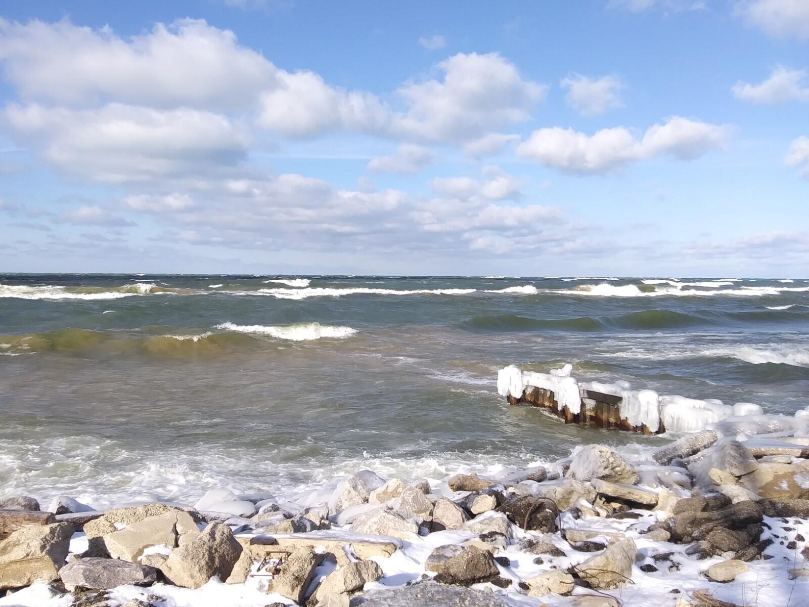 Shore, Waves, Sunny Sky, Rocks and Ice on Winter Day