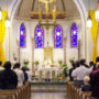 File Photo of Mass Underway Inside Church, adapted from image at army.mil