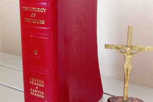 Red Liturgy of the Hours Volume II and Gold Colored Crucifix (c) Steven C. Welsh