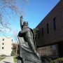 File Photo of Moses Sculpture Next to Notre Dame's Hesburgh Library, With Right Arm Raised and Index Finger Pointed Skyward