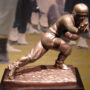 Heisman trophy image derived from photo by Robert J. La Verghetta licensed under the Creative Commons Attribution-Share Alike 2.5 Generic, 2.0 Generic and 1.0 Generic license, governed by restrictions provided therein.